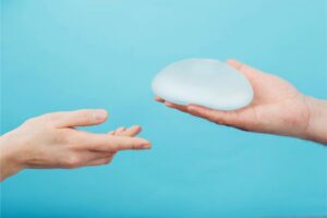 plastic surgeon holding breast silicone implant c 2025 04 01 20 39 06 utc